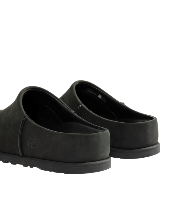 Image 3 of 4 - BLACK - UGG Men's Otzo Clog built with a luxe nubuck upper, thoughtful knit + leather lining, and a contoured footbed for steady movement. This clog has easy slip-on style with all-day comfort. Waterproof leather, nubuck upper, leather and wool jersey lining with peppermint-based anti-odor treatment. Contoured EVA footbed, lightweight rubber outsolewith embossed UGG logo. 