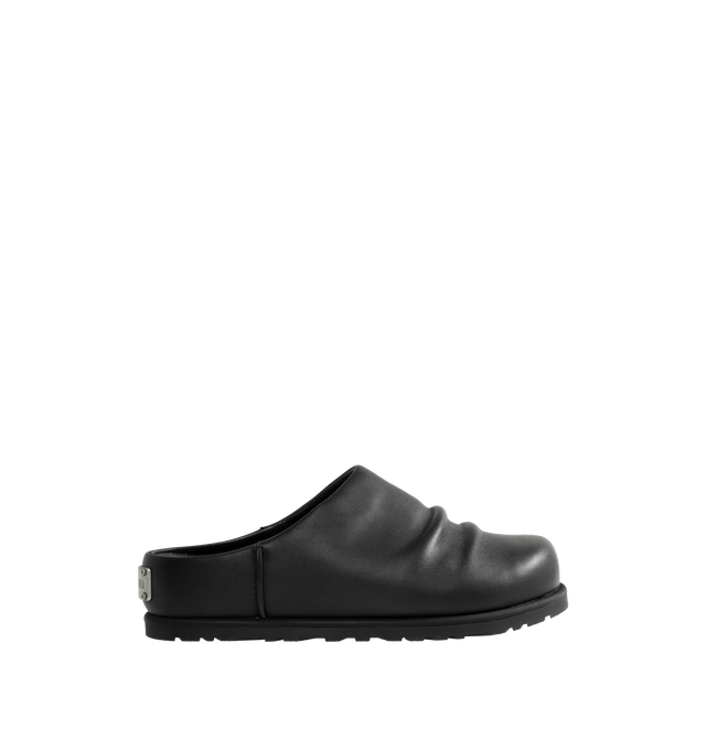 Image 1 of 4 - BLACK - UGG x Willy Chavarria Otzo Clog is crafted from premium black leather and features a slip-on silhouette for effortless everyday wear. Designed with custom Chavarria hardware logo and UGG's signature comfort-focused construction, the clog offers a refined take on casual footwear. Main Material: Leather. Unisex style in men's sizes. 