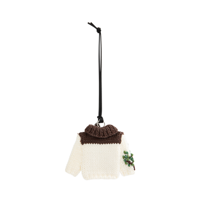 Image 2 of 3 - MULTI - JW Anderson knitted cardigan charm in white Italian wool machine-knit. Inspired by the house cardigans from the Resort 2025 show. Features hand-embroidered details in mercerised cotton yarn finished with a silver-finish metallic coat hanger attachment, logo-engraved medallion and leather cord. 90% Wool, 10% Cotton, Split Grain Calf Leather trim, 100% Coconut Shell trim. Made in Georgia. 