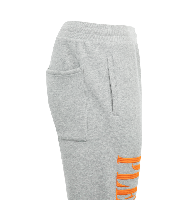 Image 3 of 3 - GREY - Pleasures Onyx Sweatpants have an elastic drawstring waist, side pockets, a back patch pocket, logo embroidery, and elastic cuffs. 57% cotton, 43% polyester.  