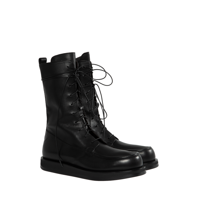 BLACK - THE ROW Patty Boot featuring vegetable tanned calfskin leather with lace-up front, stitched toe box and slim, supple shaft. 100% leather. Rubber sole. Made in Italy.