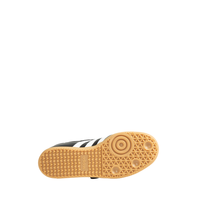 Image 4 of 5 - BLACK - Adidas Women's Samba Jane Shoes are crafted from smooth leather and feature a modern Mary Jane-inspired interpretation of the iconic Samba silhouette. Designed with signature serrated 3-Stripes, a low-profile shape, satin lining, and a gum rubber outsole, this style blends the heritage of the original indoor trainer with a contemporary everyday aesthetic. 