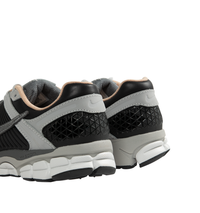 Image 3 of 5 - GREY - NIKE Zoom Vomero 5 Sneaker featuring real and synthetic leathers on upper, mesh panels and ventilation ports on heel, snappy and responsive, Air Zoom cushioning, plastic caging on side and rubber outsole. 