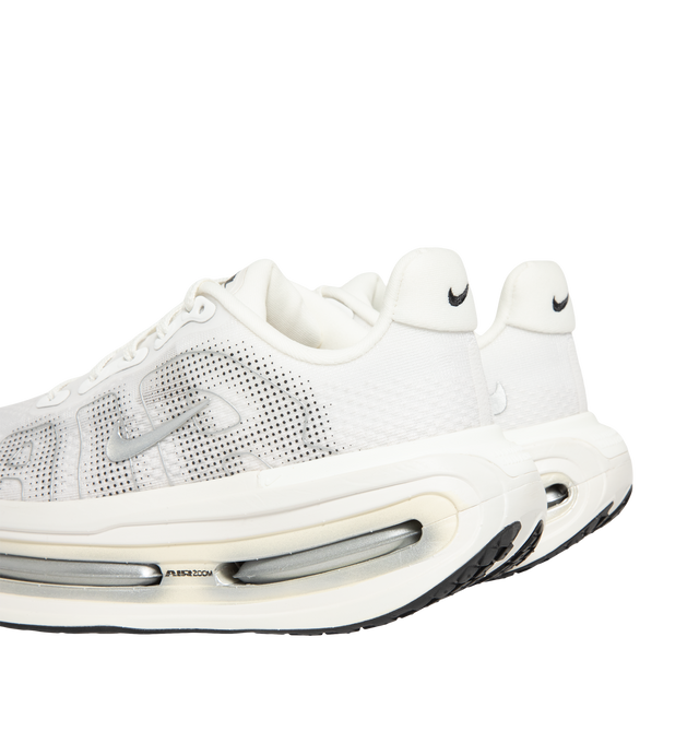 Image 3 of 5 - WHITE - Nike Women's Vomero Premium Running Shoes feature an engineered mesh upper for lightweight breathability and a secure fit. Designed for maximum cushioning, these performance running shoes combine a full-length ZoomX foam midsole with dual Air Zoom units at the forefoot and heel for exceptional comfort, responsive energy return, and a smooth ride. A durable Waffle rubber outsole provides reliable traction for everyday miles. Main Material: Mesh. Midsole: ZoomX Foam with Dual Air Zoom U 