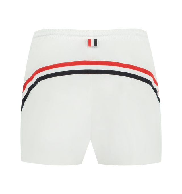 Image 2 of 3 - WHITE - THOM BROWNE Nylon Tech Track Short featuring elasticated drawstring waistband with RWB-detailed aglets, slip hand pockets, curved RWB grosgrain trim across back and signature striped grosgrain loop tab. 51% polyamide, 49% cotton. Lining: 65% polyester, 35% cotton. Made in Italy. 