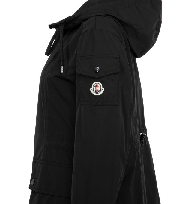 Image 3 of 3 - BLACK - MONCLER Laerte Hooded Parka featuring poplin technique, adjustable hood, zipper closure, patch pockets with snap button closure, sleeve pocket and waistband with drawstring fastening. 60% polyester, 40% cotton. 