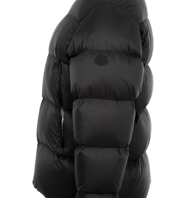 Image 3 of 3 - BLACK - Moncler Tarn Puffer Jacket has an adjustable hood, a zipper closure, zipper pockets, adjustable cuffs, an elastic hem at the back, and a silicone logo patch. Down filled. 100% polyamide. Made in Armenia. 