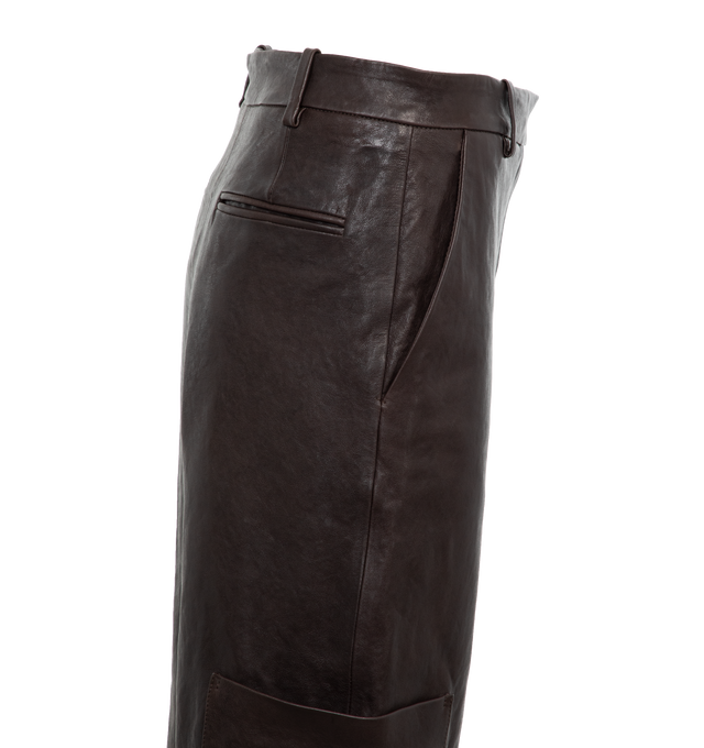 Image 3 of 4 - BROWN - KHAITE Caiton Leather Wide-Leg Cargo Pants featuring cargo pants in lambskin leather with leg patch pockets, mid rise sits high on hip, flat front, angled side slip pockets, back welt pockets, wide legs, full length and hook zip fly and belt loops. Leather. Made in Romania. 