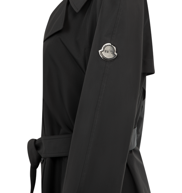 Image 3 of 3 - BLACK - Moncler x EE72 by Edward Enninful Zake Trench Coat featuring 3L technical polyester, nylon laqu sleeve lining, button closure, welt pockets, detachable belt, adjustable back slits with button closure, adjustable inner shoulder straps and logo patch. 100% polyester. Made in Romania. 