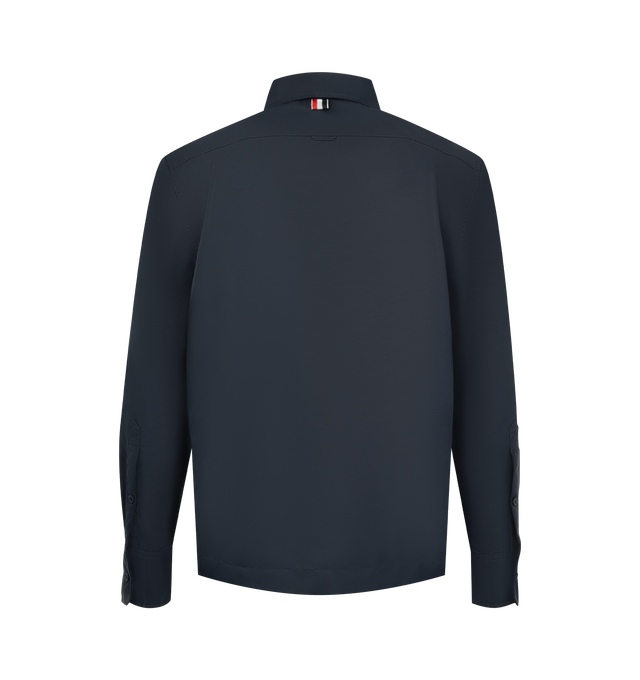 Image 2 of 3 - BLUE - Thom Browne Mens Tech Twill Shirt is crafted from lightweight technical twill. Features a button-front closure with signature RWB detailing, club collar with buttoned tab closure, buttoned flap chest pockets, buttoned cuffs, reinforced pleated back yoke with locker loop, buttoned side vents with internal RWB grosgrain trim, stepped hem, name tag appliqu, and signature striped grosgrain loop tab. Main Material: 100% Polyamide. Made in Italy. 