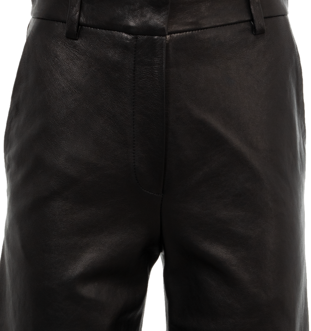 Image 4 of 4 - BLACK - KHAITE Caiton Leather Wide-Leg Cargo Pants featuring cargo pants in lambskin leather with leg patch pockets, mid rise sits high on hip, flat front, angled side slip pockets, back welt pockets, wide legs, full length and hook zip fly and belt loops. Leather. Made in Romania. 