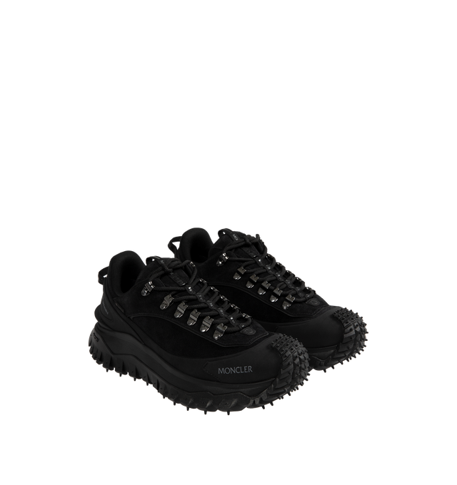 Image 2 of 5 - BLACK - Moncler Trailgrip Apex Low Top Sneakers are a lace-up style with GORE-TEX waterproof membranes, EVA midsoles, Vibram treads, OrthoLite insoles, and TPU spoiler soles. Made in Vietnam.  