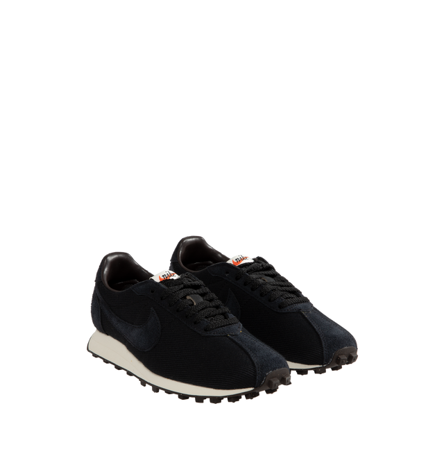 Image 2 of 5 - BLACK - Nike LD-1000 Retro Running Shoe reissued with its iconic flared heel. This edition of the heritage classic returns in minimalist black upper with white outsole. Real and synthetic leather merge with airy textiles and the iconic Waffle sole. 