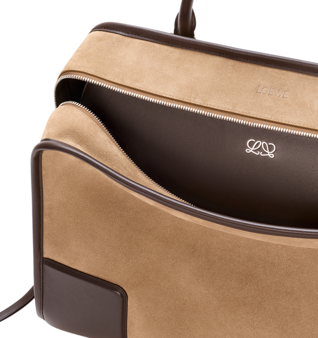 Image 10 of 16 - BROWN - Loewe Mens Amazona 180 XL Bag is crafted from suede with soft calfskin details. Features a relaxed silhouette, single toron top handle, removable shoulder handle, adjustable crossbody strap, zip closure with two leather pullers, two compartments with concealed magnetic closure, interior flat pocket, side D-ring, suede and nappa lambskin lining, palladium-tone hardware, and embossed LOEWE and Double L branding. Dimensions: 40  31  16 cm; Strap Length: 105133 cm; Strap Drop: 4761 cm;  