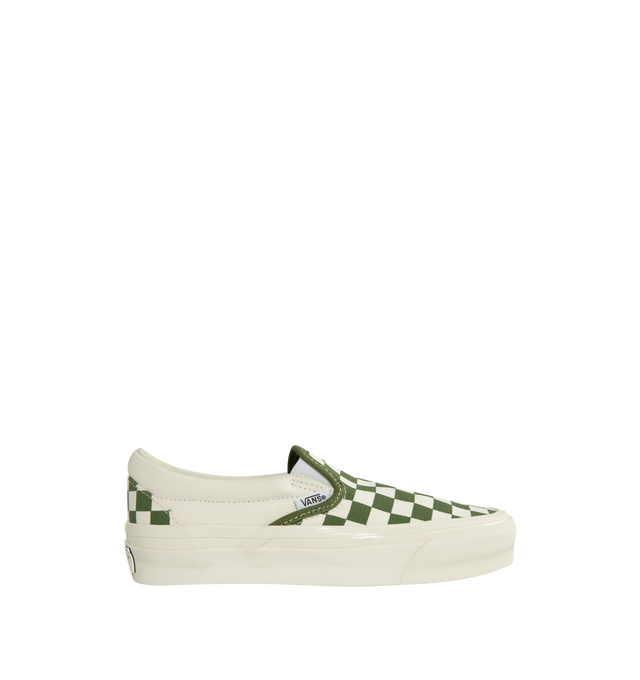 Image 1 of 5 - GREEN - VANS 98 LX Sneakers featuring low-top, slip-on, check pattern printed throughout, elasticized gussets at vamp, padded collar, logo flag at outer side, rubber logo patch at heel, partial leather and canvas lining, textured rubber midsole and treaded rubber sole. Upper: textile. Sole: rubber. Made in Philippines.