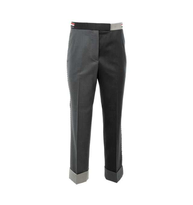 GREY - THOM BROWNE Funmix Super 120s Twill Trouser featuring tab closure, flat front, creased legs, wide cuffs, slant side pockets, button-fastening back welt pockets, adjustable buttoned side straps and signature striped grosgrain loop tab at back waist. 100% wool. 