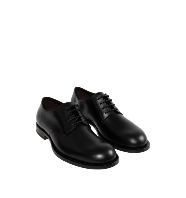 Image 2 of 4 - BLACK - THE ROW Novus Derby Shoe featuring classic lace-up oxford in polished calfskin leather with seamless molded construction, almond toe, and hand-stitched detailing. 100% calfskin leather. Made in Italy. 