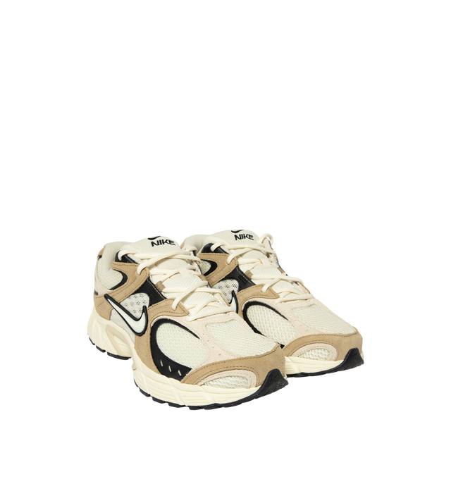 Image 2 of 5 - NEUTRAL - Nike V5 RNR Sneakers feature a streamlined silhouette designed for smooth, steady movement. A low-cut collar allows natural ankle mobility, while reflective details enhance visibility in low-light conditions. 