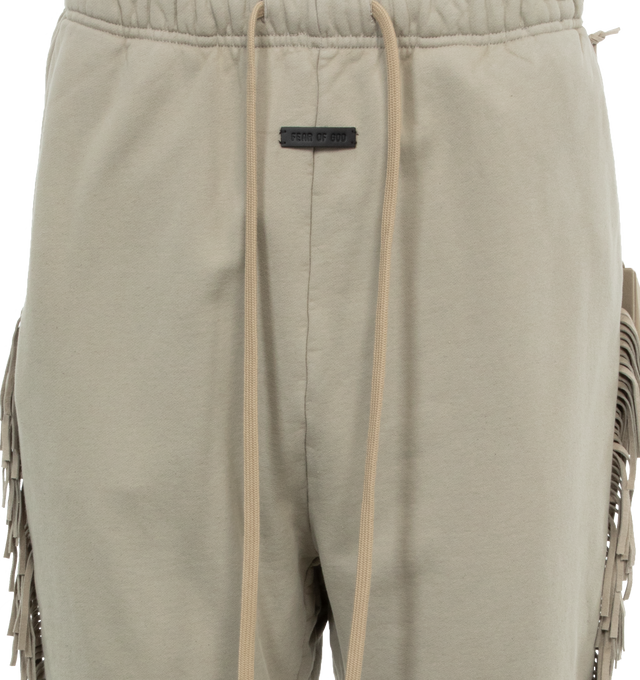 Image 4 of 4 - GREY - FEAR OF GOD Fringe Sweatpants featuring cotton fleece, fringe suede trim throughout, drawstring at elasticized waistband, two-pocket styling and rubberized logo patch at front. 100% cotton. Trim: 100% leather. Made in United States. 