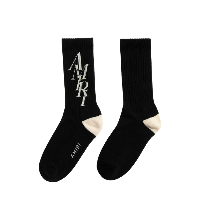 BLACK - AMIRI STACK SOCK are crew socks that feature an "Amiri Stack" logo motif on the calf, ribbed cuff to prevent slipping and reinforced toe and heel with a red contrasting color heel accent. 78% cotton, 20% polyester, 2% spandex.