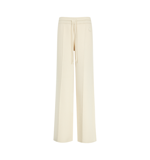 Image 1 of 3 - CREAM - Moncler Women's Double Knit Wool & Cashmere Pants are crafted in a double-knit construction with a wool and cashmere blend exterior and a soft cotton interior. Designed with a fluid silhouette and loose fit, these knit pants feature an elasticated waistband with drawstring fastening and a leather logo patch. Main Material: 54% Virgin Wool, 35% Cotton, 7% Cashmere, 3% Polyamide, 1% Elastane. Leather Patch: Calf Leather. Made in Bulgaria. 
