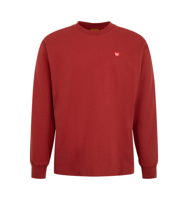Image 1 of 2 - RED - Human Made Men's Graphic L/S T-Shirt is crafted from cotton and features a boxy silhouette with long sleeves for easy everyday wear. Made from cotton with a dry handfeel and natural texture variations, this versatile style is detailed with printed graphics at the back and the brand's signature heart logo patch at the left chest. Designed to be worn on its own or layered throughout the seasons. Main Material: 100% Cotton. 