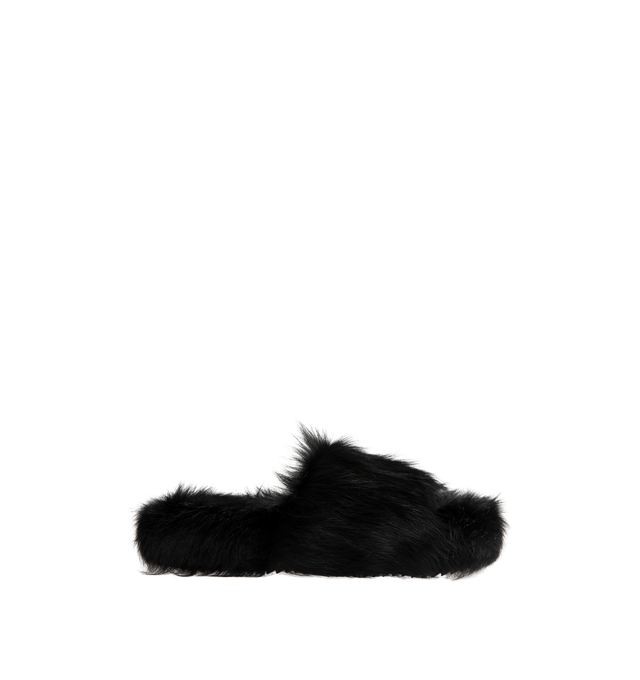Image 1 of 4 - BLACK - Rick Owens Men's Chancla Sandals are crafted from unshaved cow leather and feature an oversized flip-flop silhouette with a wide strap across the top of the foot and a rounded toe. Designed in the FW26 Tower collection, the style showcases a distinctive hair-on leather finish with an irregular melange coloration created through a specialized corrosion treatment. Main Material: 100% Cow Hair-On Leather. Lining: 100% Calf Leather. Padding: 100% Polyester. Footbed: 100% Cow Hair-On Leath 