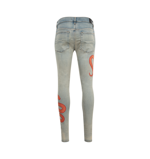 Image 2 of 3 - BLUE - Amiri Snake Skinny Jeans are a 5-pocket style with hand-distressing and designed with the brand's signature applique snake motif. Made in USA.  