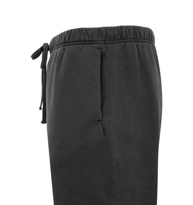 Image 3 of 3 - BLACK - FEAR OF GOD ESSENTIALS Signature Classic Flare Sweatpant featuring 520GSM heavyweight fleece, pigment-dyed, relaxed silhouette, flared leg, an encased elastic waistband with elongated drawcords, side-seam pockets, Essentials signature logo embroidered on the leg and an Essentials signature label at the center front. 100% cotton. 