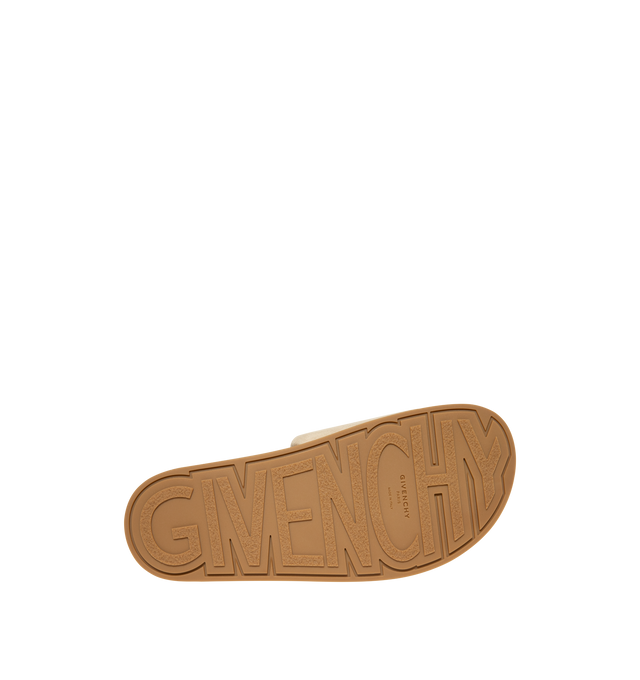 Image 4 of 5 - NEUTRAL - Givenchy Puffy Mules in Suede are crafted from supple calfskin suede and feature the house's signature Puffy silhouette with an asymmetric, slip-on design. Designed with a tonal padded label accented by a silvery Givenchy Paris logo, a branded leather insole, and a raised Givenchy signature beneath the sole, the mules combine comfort with a refined contemporary aesthetic. Main Material: 100% Calfskin Leather. Lining: 100% Calfskin Leather. Made in Italy. 