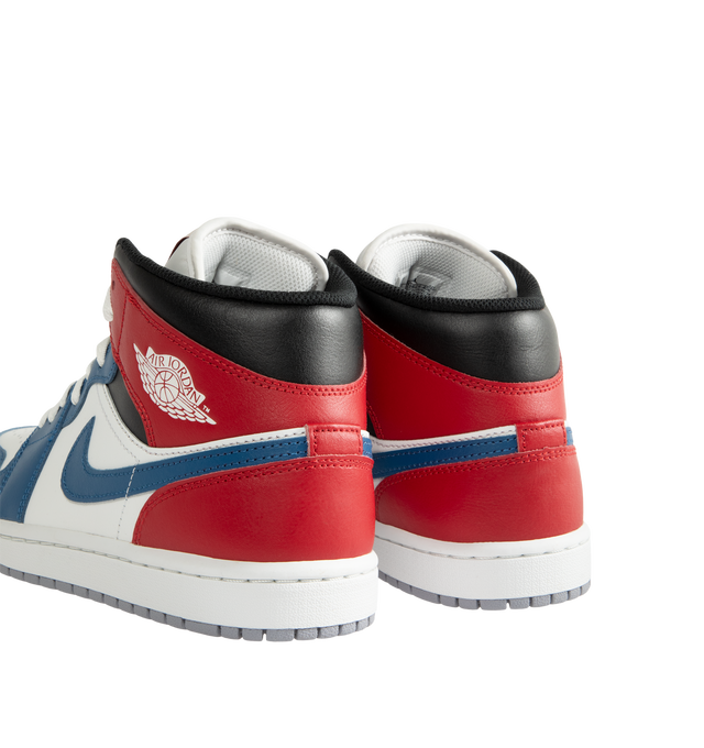 Image 3 of 5 - MULTI - Men's Air Jordan 1 Mid Sneakers feature a leather, synthetic leather, and textile upper with the iconic mid-top silhouette for a timeless heritage look. These lifestyle sneakers combine lightweight Nike Air cushioning, a foam midsole, and a durable rubber outsole with a pivot-circle traction pattern for lasting comfort, support, and reliable grip. Main Material: Leather, Synthetic Leather, and Textile. Midsole: Foam with Nike Air Cushioning. Sole: Rubber. 