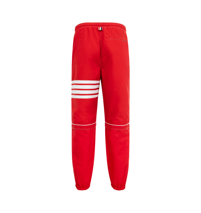 Image 2 of 3 - RED - THOM BROWNE Striped Drawstring Sweatpants featuring signature four bar striping, a drawstring waistband, elastic cuffs and side slip pockets. 100% polyester. Made in Italy. 