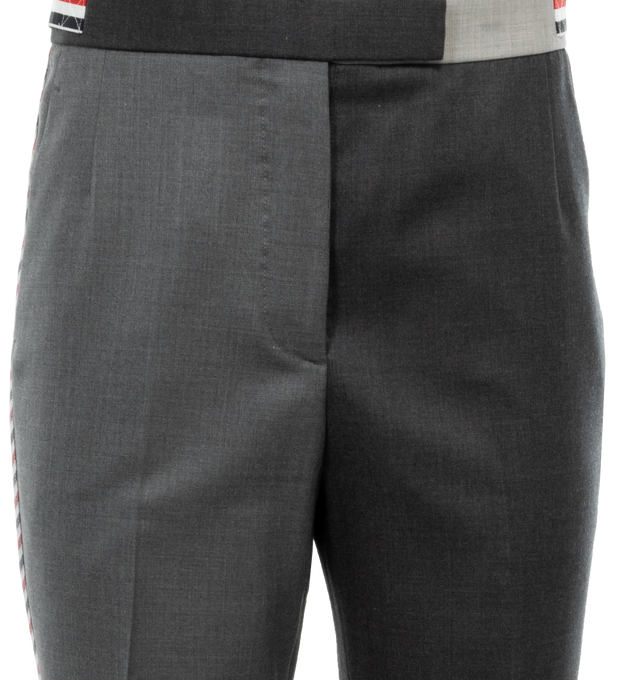 Image 4 of 4 - GREY - THOM BROWNE Funmix Super 120s Twill Trouser featuring tab closure, flat front, creased legs, wide cuffs, slant side pockets, button-fastening back welt pockets, adjustable buttoned side straps and signature striped grosgrain loop tab at back waist. 100% wool.  