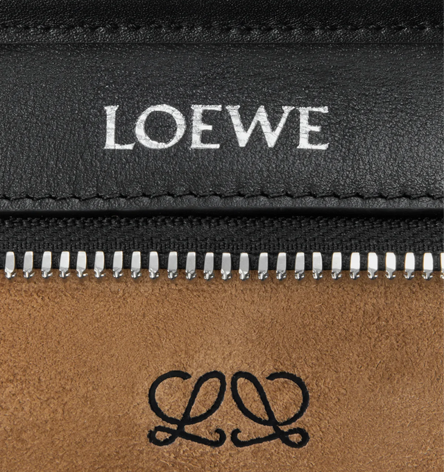 Image 9 of 11 - BLACK - LOEWE Mini Amazona 180 Bag in soft calfskin featuring two carry options: short handle, removable and adjustable crossbody strap, zip closure with two leather zip pullers, two compartments, main compartment closed with magnetic closure, left side d-ring for customization, suede lining, embossed LOEWE and embossed double L branding. Soft calfskin. 11.5 cm x 20 cm x 7 cm. Made in Spain. 