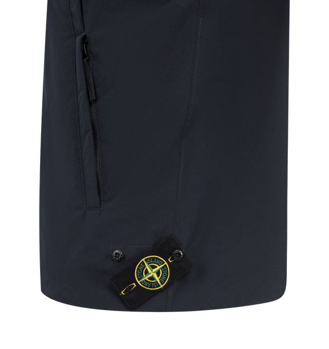 Image 3 of 3 - NAVY - Stone Island Stellina Layering Vest has a stand collar with elastic cords, a 2-way zip front closure, an embroidered brand star on the front, a snap closure chest patch pocket, side pockets with zippers, and an elastic hem. Lined. Exterior 55% wool, 40% polyamide/nylon, 5% elastane/spandex. 