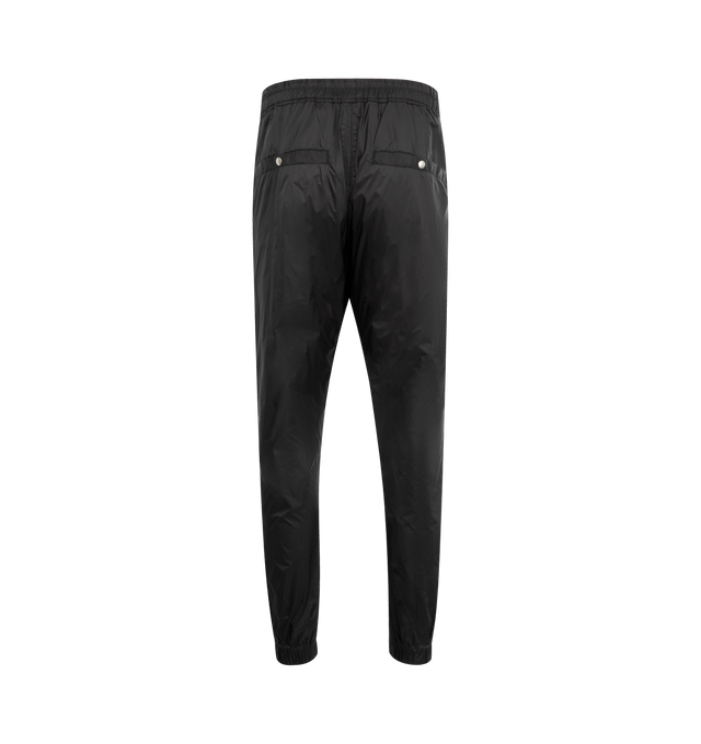 Image 2 of 3 - BLACK - Rick Owens Men's Tecuatl Track Pant crafted from black lightweight, fluid cupro twill. Full-length style with slightly dropped crotch, elasticized waist band with drawstring and stitched fly. Featuring 2 diagonal side front pockets, back welt pockets with snaps and elasticized hems with a zippered slit on the front shin.  100% Cupro, plant-based, biodegradable fabric made using repurposed cotton waste fibers. Buttons made from 100% buffalo horn. 