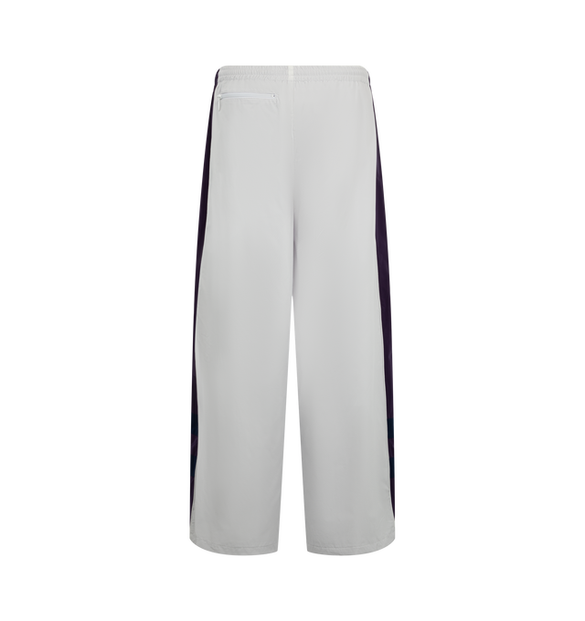 Image 2 of 3 - GREY - Needles x Fila Men's H.D. Wind Pant is crafted from lightweight technical fabric and features the signature H.D. silhouette with a voluminous, curved leg shape. Created in collaboration with Fila, this relaxed-fitting style combines sportswear functionality with Needles' distinctive proportions for a modern interpretation of a classic wind pant. Main Material: Technical Fabric. Fit: Relaxed. Silhouette: H.D. Wide Leg. Collaboration: Needles x Fila. Made in Japan. 