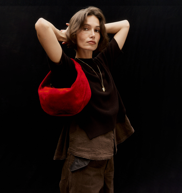 Image 2 of 5 - RED - Khaite Olivia slouchy zip-top hobo bag in velvety suede. With integrated strap to wear over the shoulder or carry by hand. Signature hardware at zipper pull. Suede (100% kid leather). Made in Italy. 