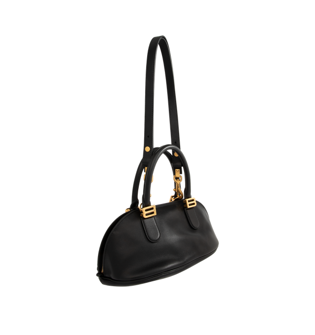Image 2 of 4 - BLACK - BALENCIAGA Bolero Bowling Bag Mini featuring smooth calfskin, two handles with Bolero B logo, adjustable and removable strap, shoulder, crossbody and hand carry, aged-gold hardware, zipped closure with leather pull tab and ring, zipped pocket on the bottom with leather pull tab and ring, 1 main compartment and contrasting nappa lambskin lining. 11.8" x 5.1" x 6.3". Calfskin. Made in Italy. 