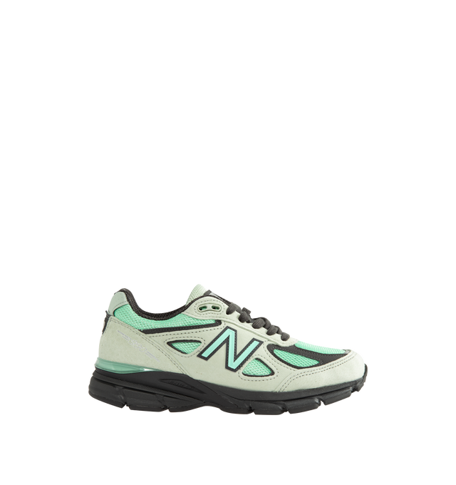 Image 1 of 5 - GREEN - New Balance Unisex Made in USA 990v4 Sneakers feature a timeless performance-inspired silhouette enhanced with premium materials and heritage craftsmanship. Constructed with a breathable mesh upper, suede and synthetic overlays, and a durable NDurance rubber outsole, this iconic style combines comfort and support for everyday wear. ABZORB cushioning at the heel and forefoot absorbs impact through a combination of cushioning and compression resistance, while the ENCAP and C-CAP midsole 