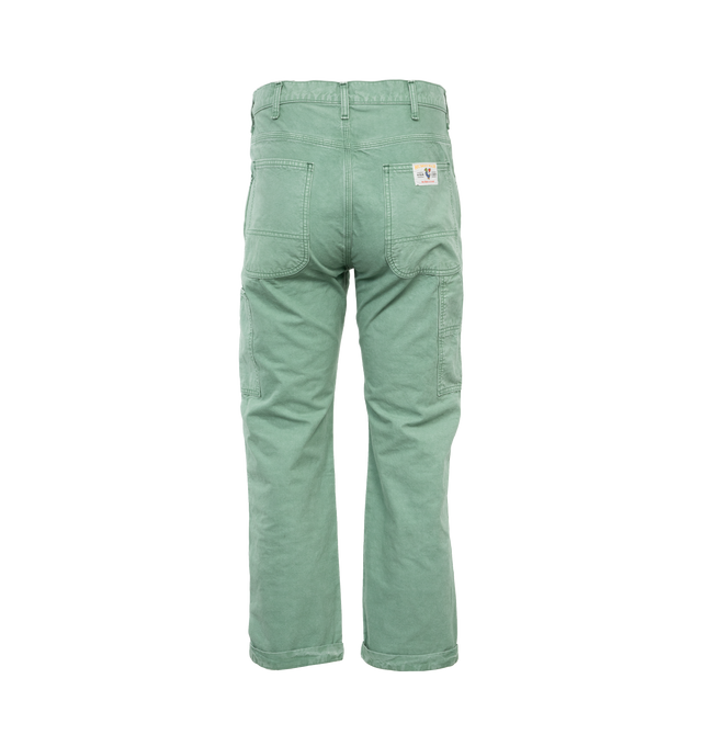 Image 2 of 4 - GREEN - HUMAN MADE Garment Dyed Painter Pants featuring straight cut, side pockets, garment dyed, carabiner hook, duck pocket patch and button fly. 100% cotton. 
