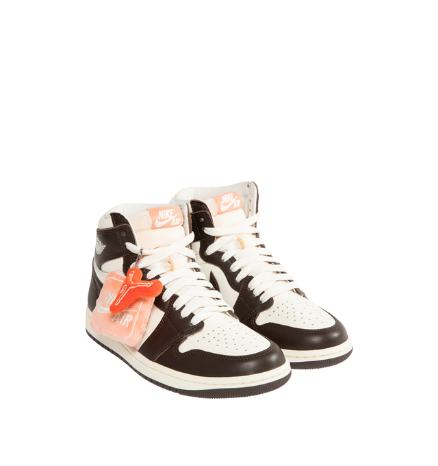 Image 2 of 5 - BROWN - JORDAN Air Jordan 1 Retro High OG Sneaker featuring soft cushioning, a padded ankle collar, premium construction, lace up closure and encapsulated Nike Air-Sole unit in the heel. 
