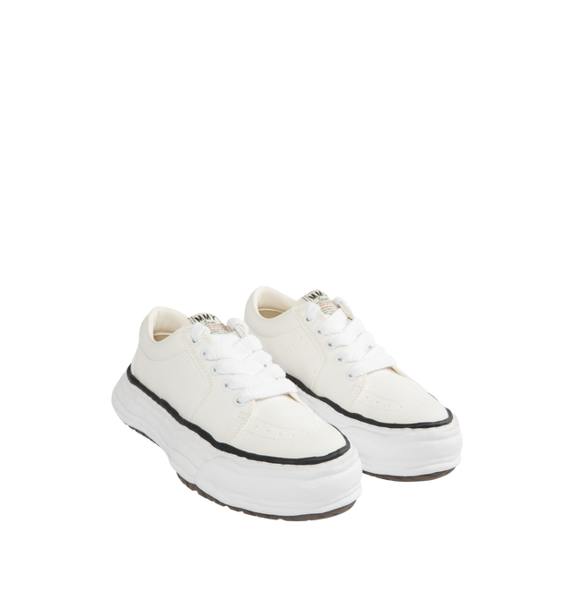 Image 2 of 5 - WHITE - Maison Mihara Yasuhiro Men's Eric Sneakers feature the brand's signature hand-sculpted OG sole, a mixed-material suede and canvas upper, and distinctive toe stitching for a bold contemporary look. Designed for the Spring/Summer 2026 collection, these designer low-top sneakers combine Maison Mihara Yasuhiro's experimental aesthetic with everyday comfort, while the handcrafted-inspired sole and intentional vintage detailing create a truly distinctive silhouette. Main Material: Cow Leath 