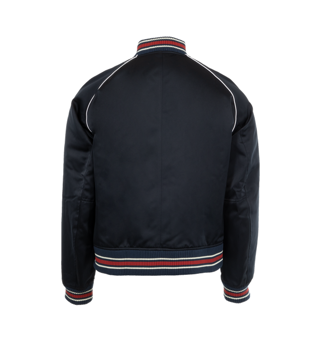 Image 2 of 3 - NAVY - Wales Bonner Men's Marvel Bomber Jacket with logo patch at chest and striped ribbed trims. Featuring crewneck, front zip fastening, long sleeves, snap-button fastening pockets at side, and rib trims. Made in Italy. 100% Polyester.  