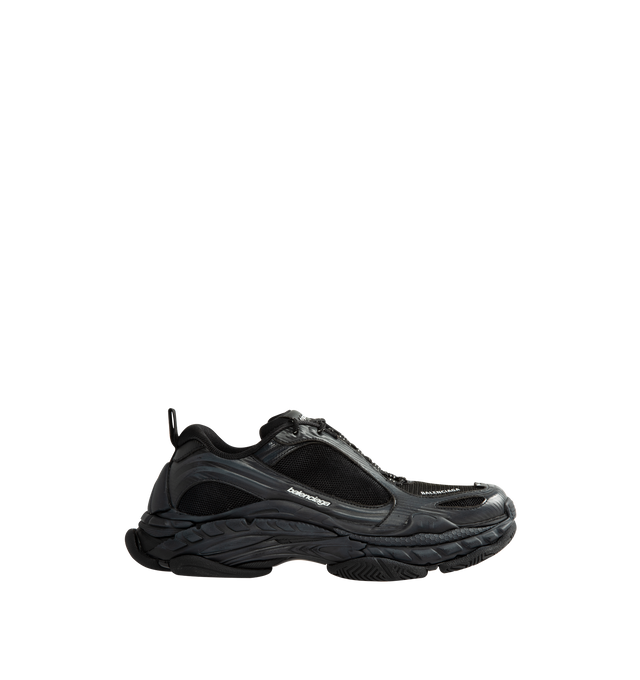 Image 1 of 5 - BLACK - Balenciaga Men's Triple S Clear Sole Sneaker is crafted from leather-free double foam and mesh and features the signature Triple S silhouette with a complex three-layer outsole incorporating Clear Sole technology. Detailed with an embroidered size at the toe edge, an embroidered logo at the side, an embossed logo at the back, and Triple S rubber branding at the tongue, this sneaker is finished with a 12-eyelet lacing system, bicolor hiking-inspired laces, an additional pair of laces,  