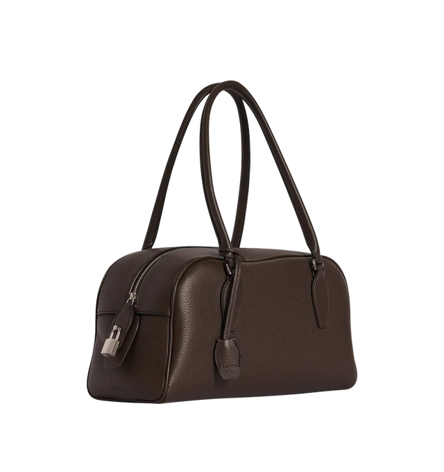 Image 2 of 3 - BROWN - THE ROW E/W India Bag featuring bowling bag in textured calfskin leather with elongated silhouette, extended tubular handles, piping, branded metal padlock and key and top zipper closure. 13.4 x 6.7 x 5.3 in. Antique silver hardware finishing. 100% calfskin leather. Lined in 100% lambskin leather. Made in Italy.  