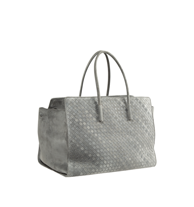 Image 2 of 3 - GREY - Bottega Veneta Women's Large Intrecciato Suede Tote Bag is crafted from supple Intrecciato suede and features a streamlined silhouette, a single-compartment interior, and a zip-top closure. Designed with snap-button attachments for the Dustbag Organizer system, it is finished with one interior zip pocket, an internal hand mirror with a leather cover, lambskin lining, and silver-finish hardware. Main Material: Intrecciato Suede. Lining: Lambskin. Hardware: Silver Finish. Made in Italy.  