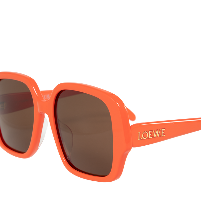 Image 3 of 3 - ORANGE - LOEWE Square Slim Sunglasses featuring square-shaped frame in a slim acetate construction with LOEWE in a gold finish on the temple. 100% UVA/UVB protection. 