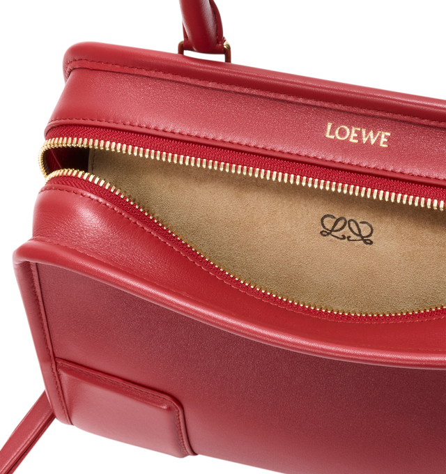 Image 11 of 18 - RED - Loewe Small Amazona 180 Bag in leather features a relaxed silhouette anchored by a single toron top handle, designed to be carried open, while a concealed closure secures the main compartment, three carry options: short handle, removable shoulder strap and crossbody, zip closure with two leather zip pullers, two compartments, main compartment closed with magnetic closure, internal flat pocket, left side d-ring for customization, nappa lambskin lining, and embossed double L branding. L 