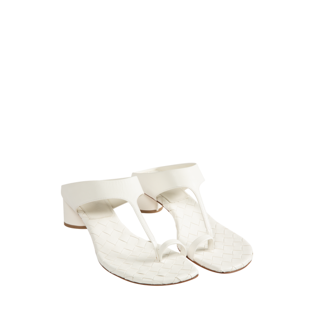 Image 2 of 4 - WHITE - Bottega Veneta Womens Kitten Heel Thong Sandals are crafted from nappa leather. Feature a toe-ring leather strap, Intrecciato leather insole, lambskin lining, kitten heel, and rubber-injected leather outsole. Upper: Nappa Leather; Lining: Lambskin; Outsole: Rubber-Injected Leather. Made in Italy. 